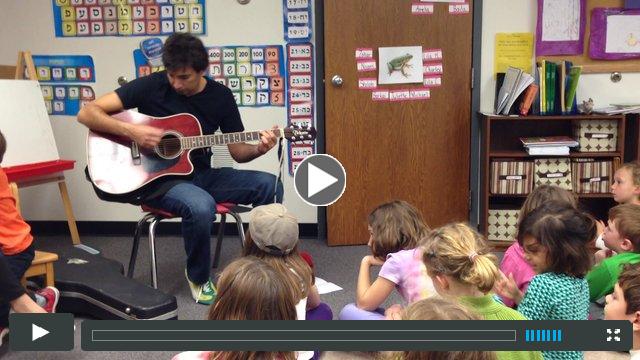 MJCDS parent Adam Weil plays original music for the students.