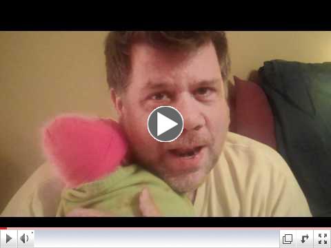 Adam McManus holds Mercy after her first bath.