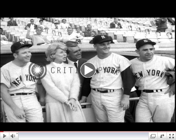 Doris Day and Cary Grant with Baseball players to promote their film 