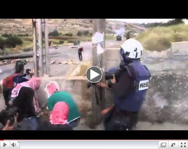 Palestinian terrorists hide behind journalists while firebombing Israeli soldiers