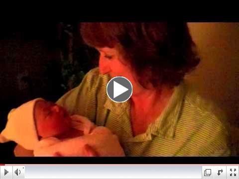 Deanna Holzer, Amy's mother, cuddles with Mercy Geneva McManus.