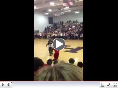 Mascots from Louisville Male and duPont Manual high schools fight during basketball game
