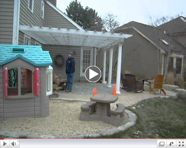 Installer hops locked fence escorted by armed Naperville police.AVI
