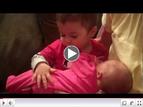 Honor McManus meets his new baby sister Mercy Geneva.
