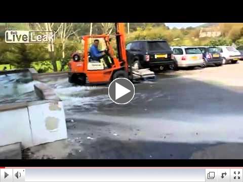 Forklift destroys car park fish pond