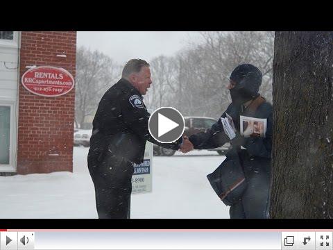 Officer Schnickel thanks postal workers for Thank A Mail Carrier Day