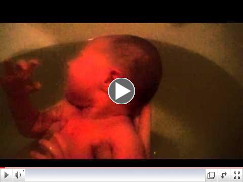 Mercy Geneva McManus takes her first bath.