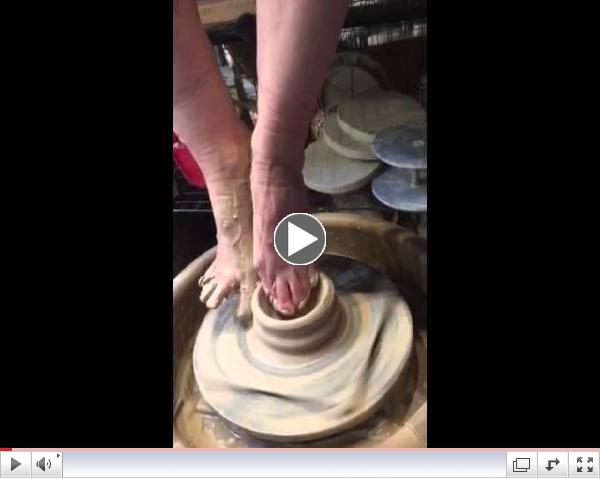 Witness Nancy Bulkley demonstrating throwing a bowl with her feet, at the Yourist Pottery Studio .