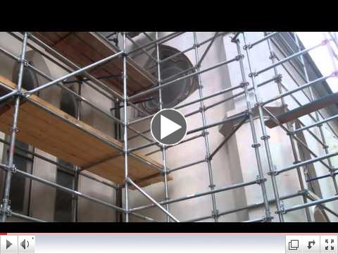 Mesh on scaffolding on stucco