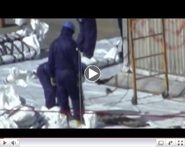 Open air asbestos abatement at Domino Sugar Refinery, Williamsburg, Brooklyn